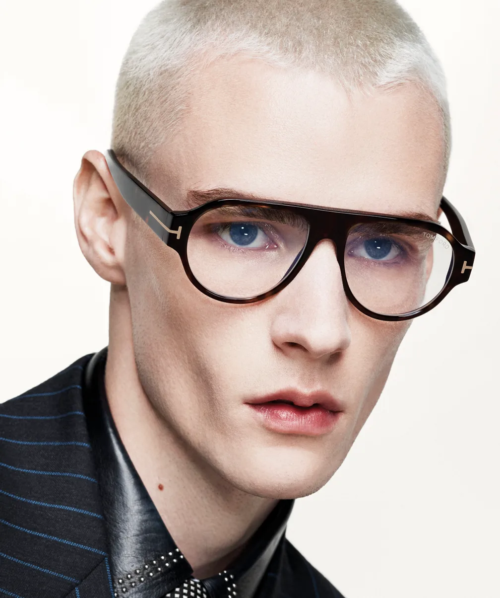 Model wearing dark aviator eyeglasses in a Tom Ford optical campaign